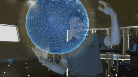 Tony Stark using natural language to command Jarvis to transform holographic data